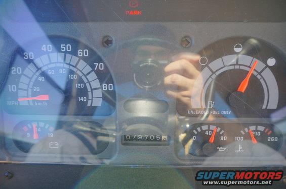 Dashboard gauges with speedometer, fuel gauge, oil pressure, and temperature