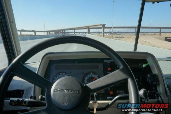 Interior view of a 1995 Chevrolet P30 1 Ton - Step Van dashboard and steering wheel while driving
