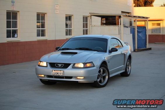 Silver 2002 Ford Mustang coupe with a scoop on the hood