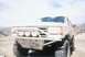 1988 Ford Bronco - This 1988 Ford Bronco features a custom front bumper with integrated lights and a Ford logo.