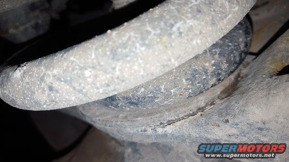 Suspension coil and bracket with Supermotors.net logo
