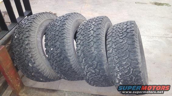 four off-road tires lined up