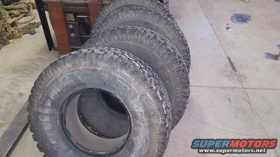 Four stacked tires on a forklift