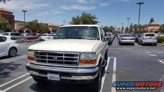 White 1995 Ford Bronco parked in a lot, front 3/4 view