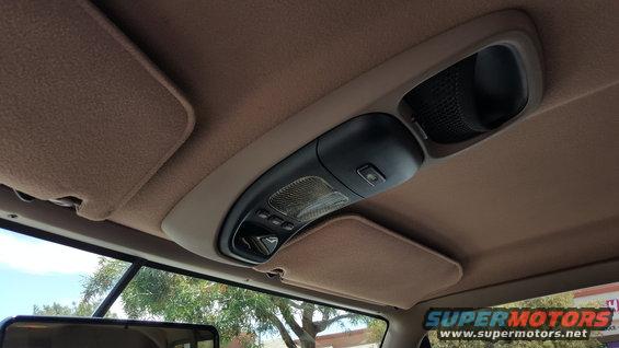 Interior overhead console with lights and sun visors