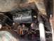 1979 Ford Bronco - Vehicle undercarriage with an air tank mounted above the exhaust system.