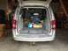 1979 Ford Bronco - Silver minivan with its trunk open, revealing a blue engine and various items inside.