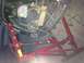 1979 Ford Bronco - Engine hoist secures a 1979 Ford Bronco engine for installation.