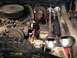 1979 Ford Bronco - Engine bay with air horns and compressor. Year is not identifiable.