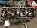 1979 Ford Bronco - Close-up of an engine's valve train, showing rocker arms and an oil filter. Supermotors.net logo is present.