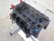 1979 Ford Bronco - This is a close-up view of a bare engine block, likely undergoing or awaiting rebuild, resting on an engine stand.