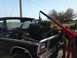 1979 Ford Bronco - Engine removal in progress on a 1979 Ford Bronco using an engine hoist.
