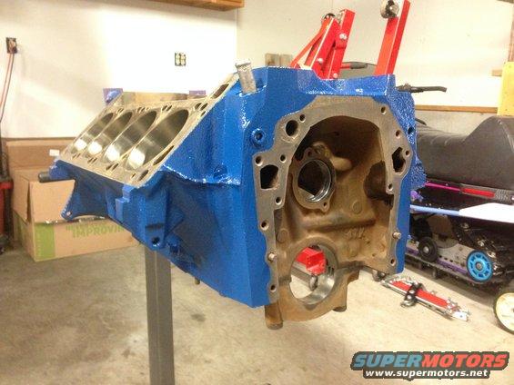 Blue engine block on stand, engine rebuild in progress