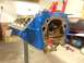 1979 Ford Bronco - Engine block painted blue and mounted on a stand, likely for an engine rebuild project.