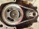 1979 Ford Bronco - Close-up view of an engine's timing chain and gears, indicating internal engine components.