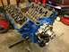 1979 Ford Bronco - V8 engine block on an engine stand, with valve covers removed and water pump attached.