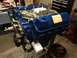 1979 Ford Bronco - Engine on stand, likely undergoing rebuild or maintenance. Oil filter and fuel pump are attached.