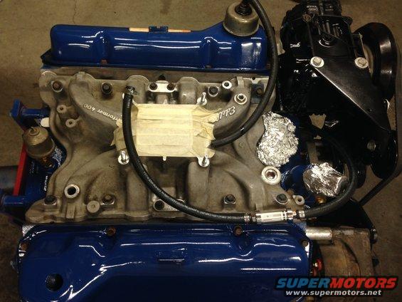Engine intake manifold with "Performer 400" text, taped section, and aluminum foil