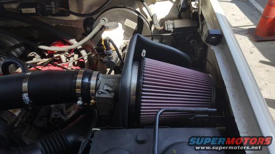 Engine bay with K&N air filter and black intake tube