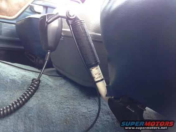 CB radio microphone attached to seat in vehicle interior