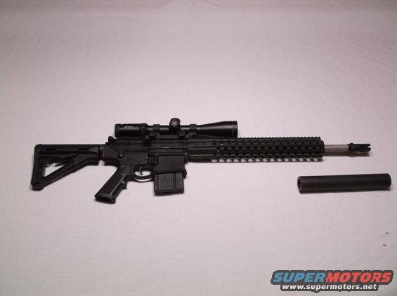 Rifle with scope and suppressor