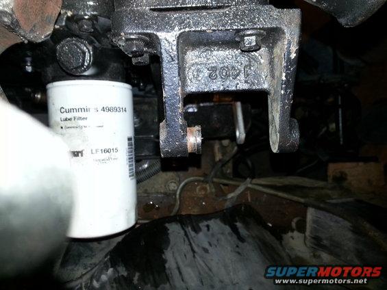 Cummins oil filter and engine bracket with part number 1402