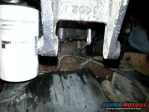 Cummins lube filter and cast metal bracket with part number 1402 D visible