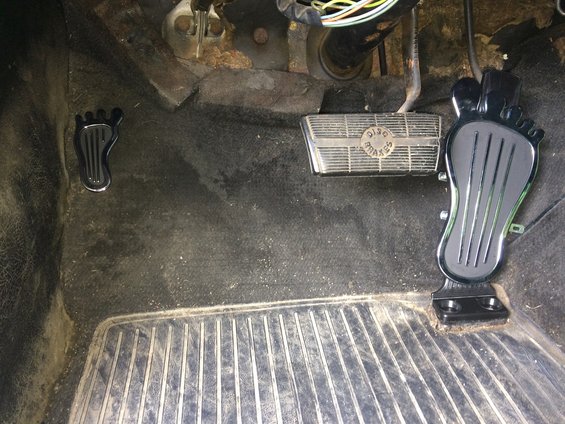 Driver's side floorboard and pedals in a vehicle