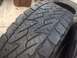 1986 Ford Bronco - Close-up view of a tire's tread pattern, showing the blocky design.
