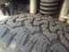 1986 Ford Bronco - Tire tread detail with suspension components visible.
