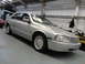 1999 Ford Fairlane - Silver 1999 Ford Fairlane sedan parked inside a garage with the front quarter visible.