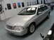 1999 Ford Fairlane - A silver sedan is parked indoors, with other vehicles visible in the background. The registry lists it as a 1999 Ford Fairlane.