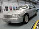 1999 Ford Fairlane - Silver 1999 Ford Fairlane sedan is parked inside a garage with posters on the wall.