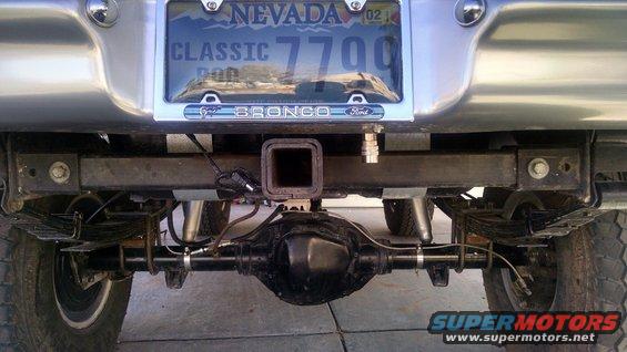 Rear view of a Ford Bronco showing the axle, hitch, and Nevada license plate that reads 'CLASSIC 7700'