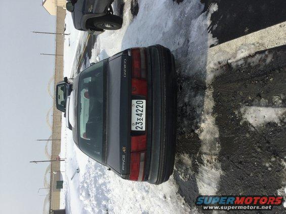 Daewoo Prince sedan parked on snowy ground, with another vehicle partially visible