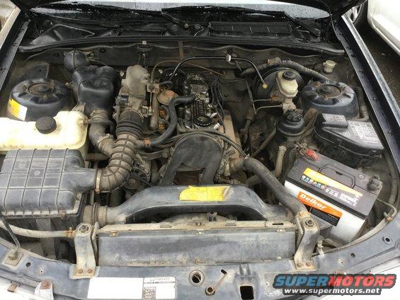 Engine bay with Delkor battery and Supermotors.net logo