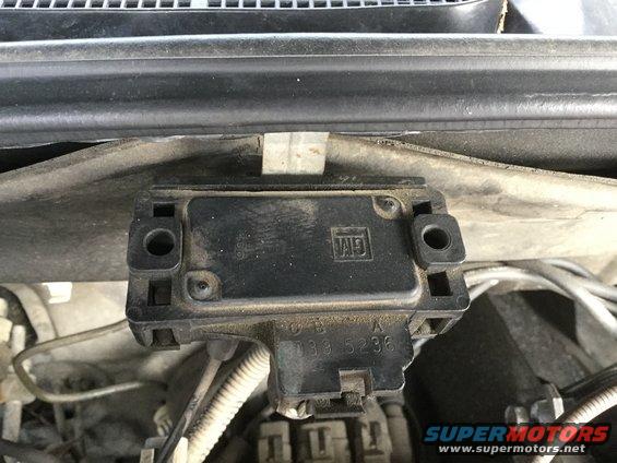 Black GM electronic control module with part number 139 5236 visible, mounted in engine bay