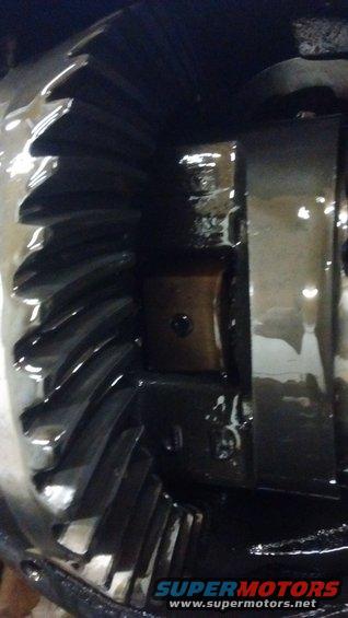 Close-up of differential gears with dark lubricant