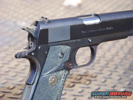 Close-up of Colt Government Model pistol slide and grip