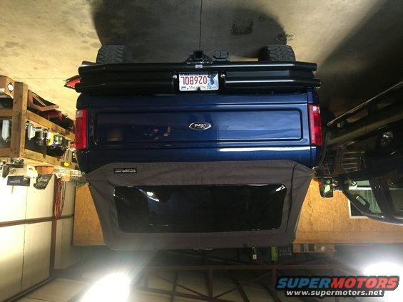 Blue 1982 Ford Bronco rear view with custom bumper and soft top