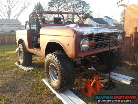 1972 Ford Bronco with rust, missing doors, on jack stands
