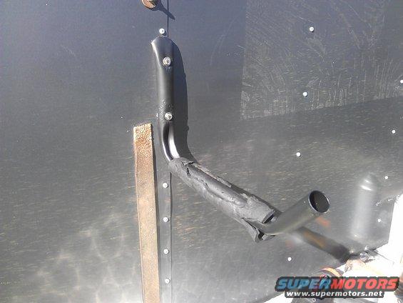 Ladder rack part attached to dark metal wall