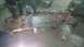 2000 Chevrolet Astro - Workers cut apart a vehicle's front end frame assembly, with sparks flying from the grinder.