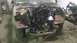 2000 Chevrolet Astro - Disassembled engine bay of a vehicle, with parts and tools scattered around.