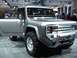 1995 Ford Bronco - This silver Ford Bronco concept vehicle is displayed with its driver's door open, revealing its interior and large tires.