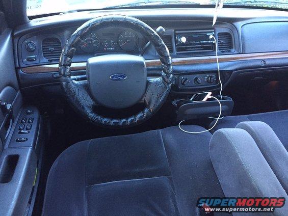 2008 Ford Crown Victoria interior with dashboard, steering wheel, and seats