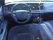 2008 Ford Crown Victoria - The interior of a 2008 Ford Crown Victoria shows the dashboard, steering wheel, and front seats.