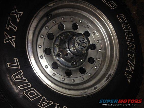 Close-up of a chrome wheel with a BFGoodrich Radial XTX tire and a 4x4 automatic locking hub