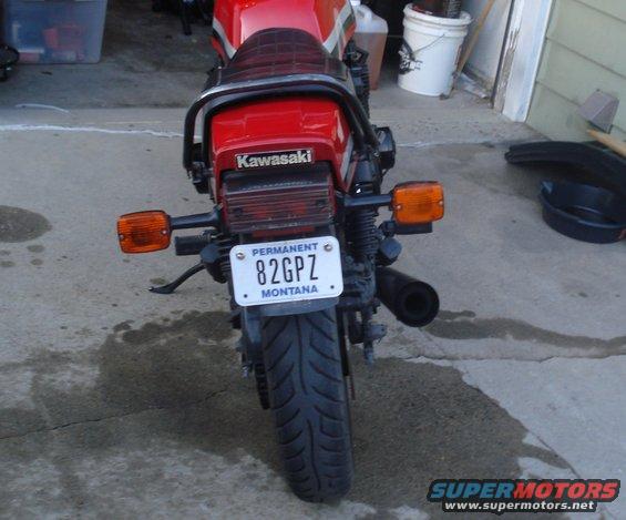 Red Kawasaki motorcycle rear with license plate 82GPZ