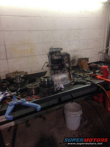 transmission parts and tools laid out on a workbench